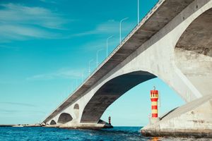 Police say woman drifting in sea near bridge was dead