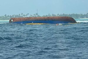 Two missing from capsized boat carrying cargo