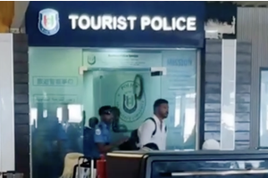 American who assaulted airport staff released with travel ban