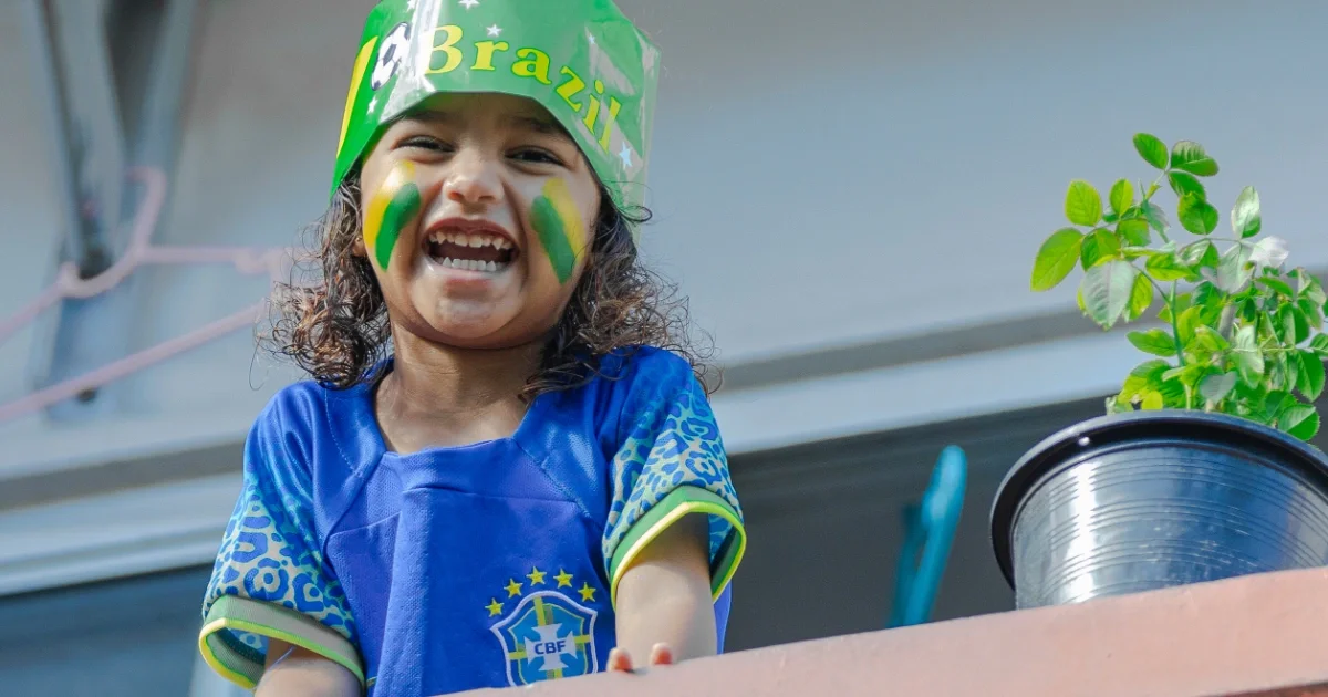 A young Brazil supporter looks out from a balcony in Hulhumale' after watching the match between Brazil and Haiti. -- Photo: Mohamed Shahuzan / Adhadhu